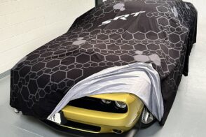 Car Reveal Cover over Dodge Challenger showing headlamp